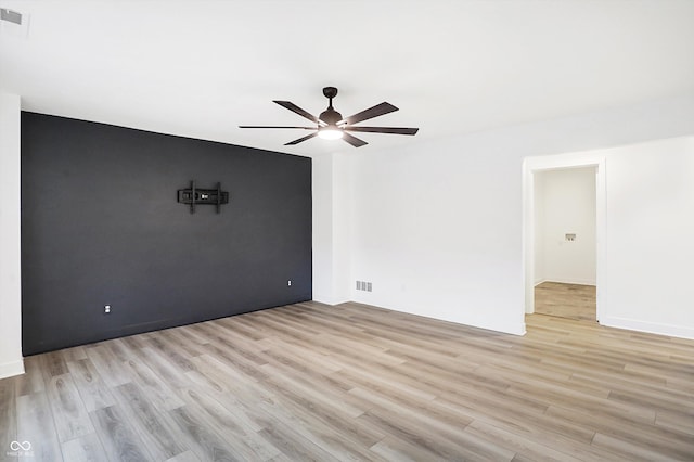 unfurnished room featuring ceiling fan and light hardwood / wood-style floors