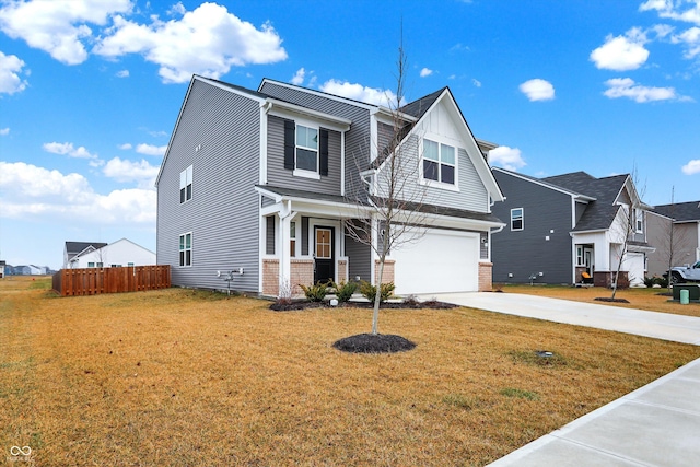 view of front of house with a front yard and a garage