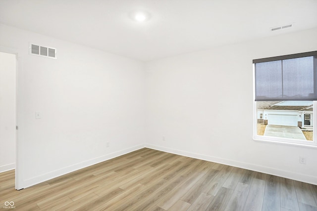 unfurnished room featuring light wood-type flooring