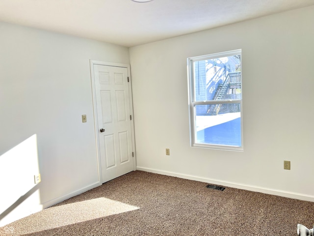 empty room featuring carpet floors