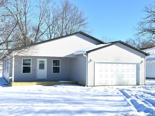 ranch-style home featuring a garage