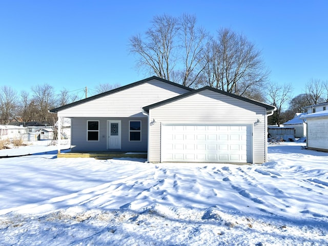 single story home featuring a garage