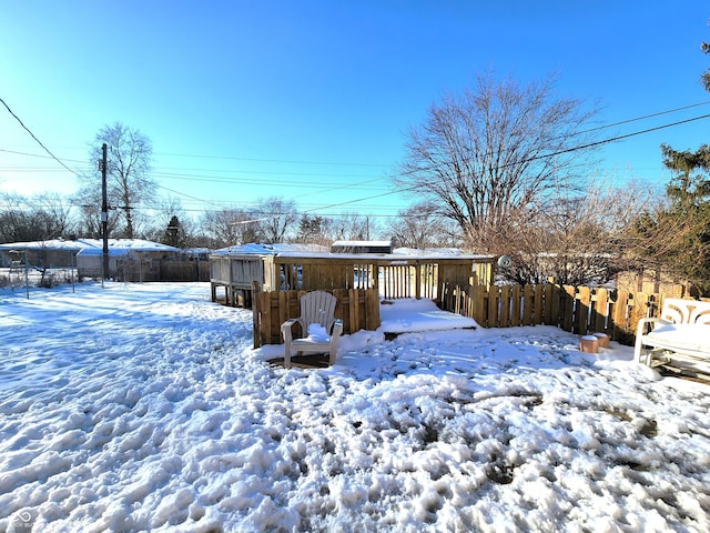 view of yard layered in snow