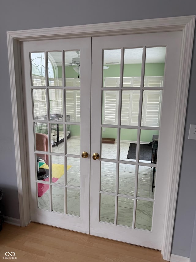 doorway featuring hardwood / wood-style flooring and french doors