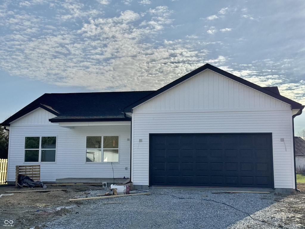 single story home featuring a garage