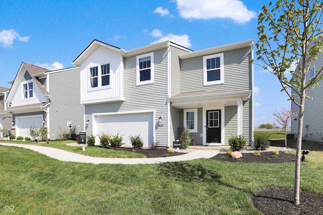 view of front of home featuring an attached garage and a front lawn