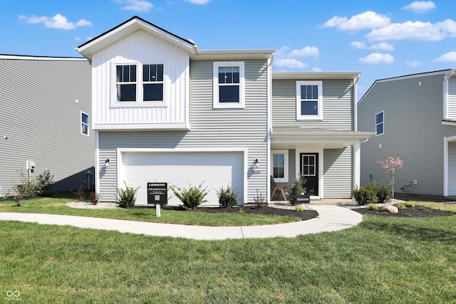 view of front of property featuring a garage and a front yard