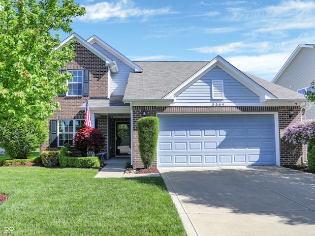 view of front property featuring a garage and a front lawn