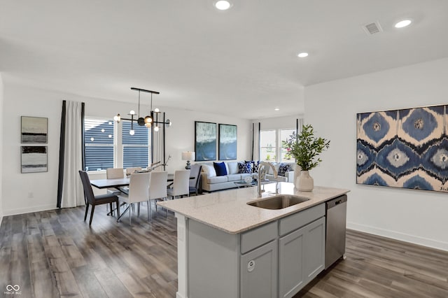 kitchen featuring visible vents, dark wood-style floors, a sink, stainless steel dishwasher, and recessed lighting