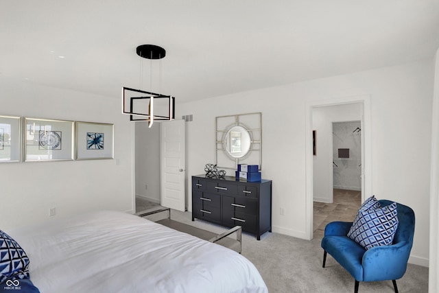 bedroom with light carpet, visible vents, and baseboards