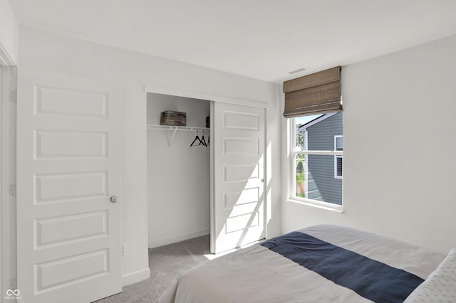 unfurnished bedroom featuring carpet floors, a closet, and baseboards