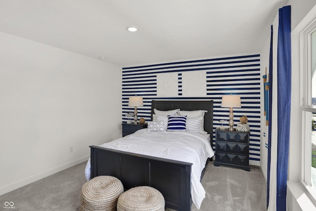 bedroom with wallpapered walls, baseboards, an accent wall, carpet floors, and recessed lighting