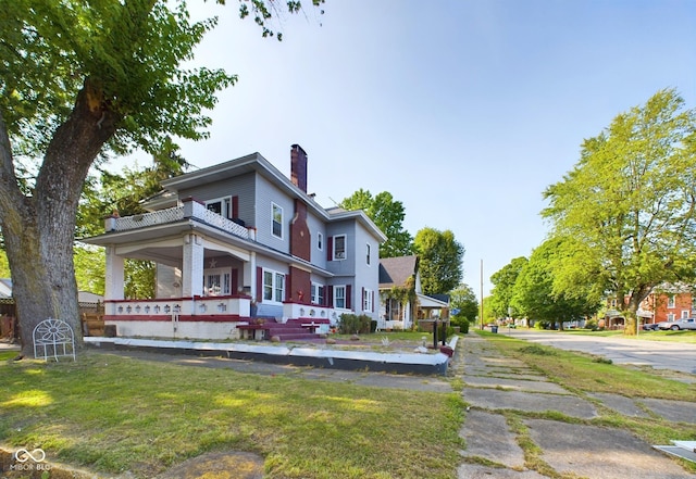 exterior space with a front lawn and a porch