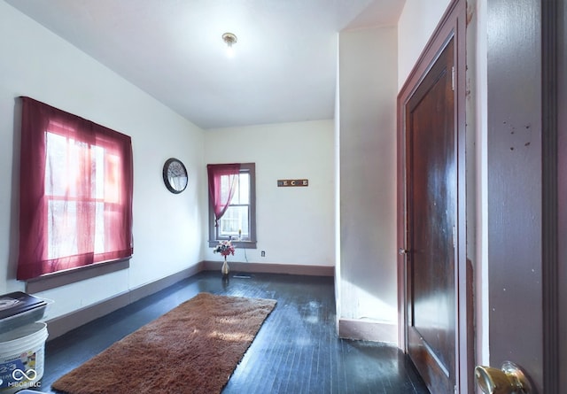 foyer with dark hardwood / wood-style floors