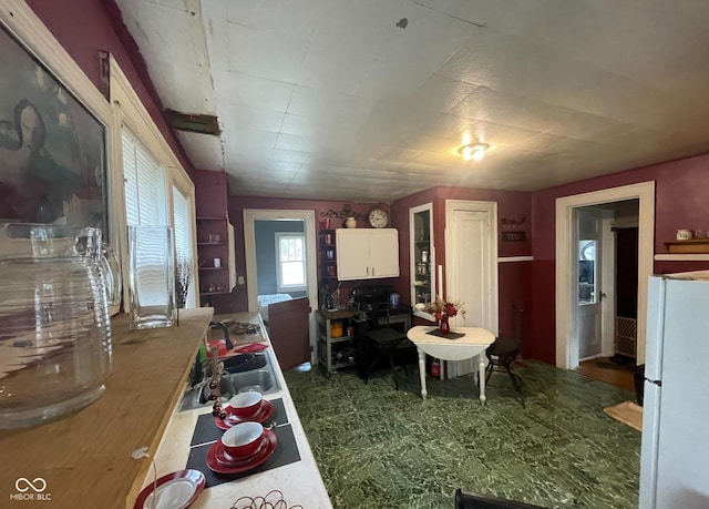 kitchen featuring sink and white refrigerator