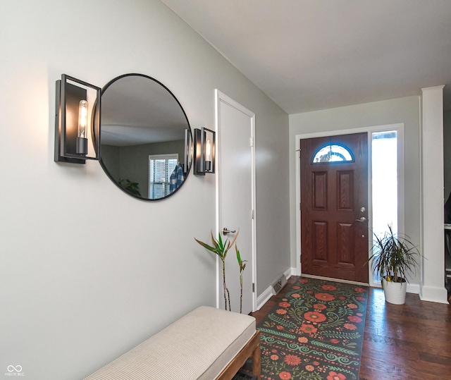 foyer entrance with dark wood-type flooring