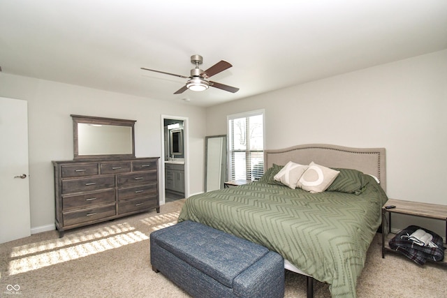 carpeted bedroom featuring ensuite bathroom and ceiling fan