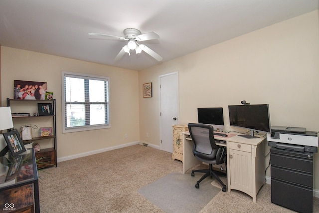 office with light colored carpet and ceiling fan