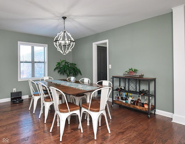 dining area featuring an inviting chandelier and dark hardwood / wood-style floors