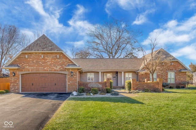 view of front facade with a garage and a front yard