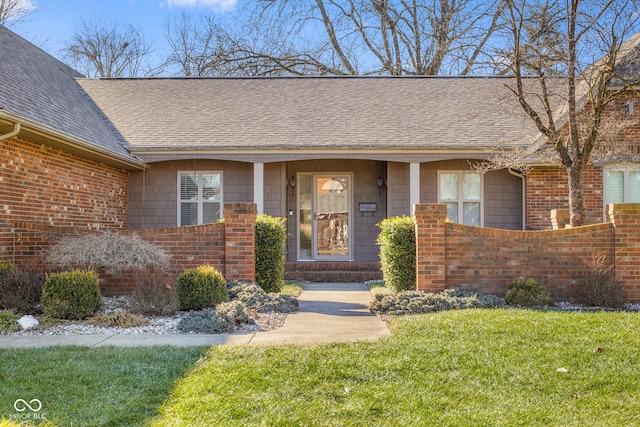 entrance to property with a yard