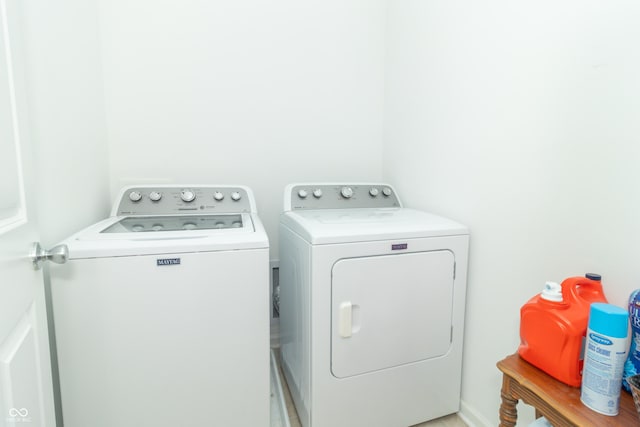 laundry area with separate washer and dryer