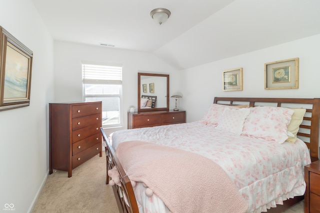 carpeted bedroom featuring vaulted ceiling