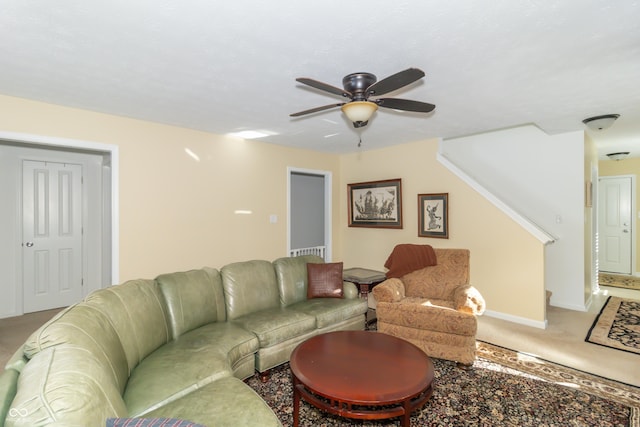 carpeted living room featuring ceiling fan