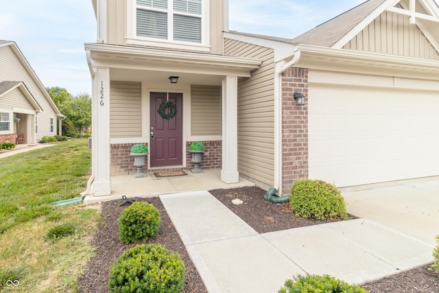 1226 Arlington Dr, Greenfield, IN 46140 - doorway to property with brick siding, board and batten siding, a garage, a lawn, and covered porch