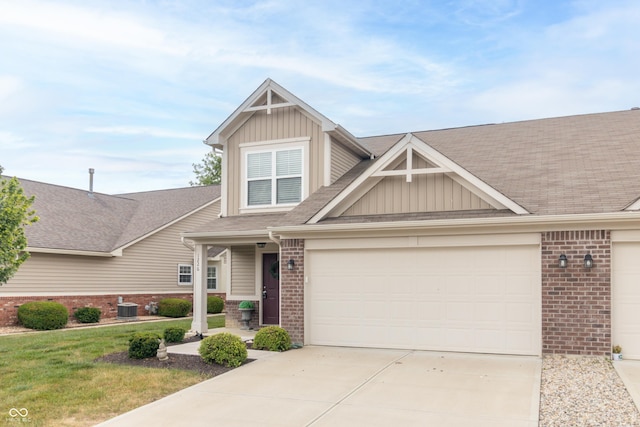 1226 Arlington Dr, Greenfield, IN 46140 - craftsman-style house featuring board and batten siding, brick siding, concrete driveway, and a shingled roof