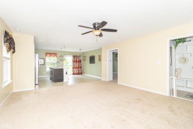 1226 Arlington Dr, Greenfield, IN 46140 - unfurnished living room featuring light carpet and a ceiling fan