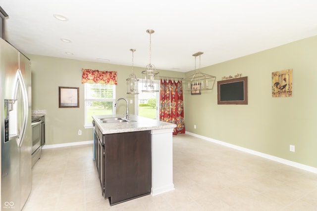 1226 Arlington Dr, Greenfield, IN 46140 - kitchen featuring stainless steel fridge with ice dispenser, stove, light countertops, dark brown cabinets, and an island with sink