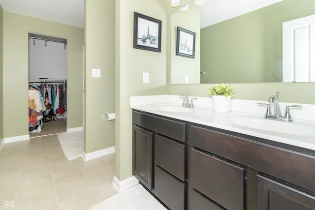 1226 Arlington Dr, Greenfield, IN 46140 - bathroom featuring double vanity and a walk in closet