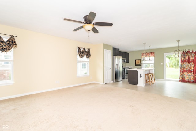 1226 Arlington Dr, Greenfield, IN 46140 - unfurnished living room with ceiling fan and light carpet