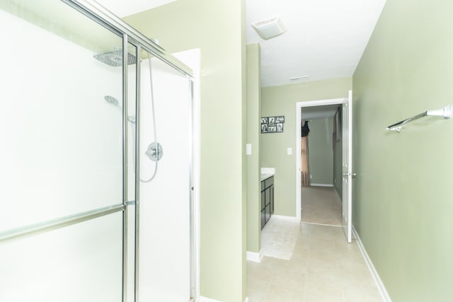 1226 Arlington Dr, Greenfield, IN 46140 - bathroom with a stall shower, vanity, and tile patterned floors