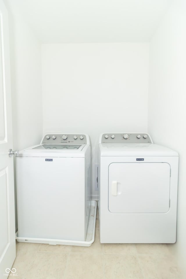 1226 Arlington Dr, Greenfield, IN 46140 - washroom featuring separate washer and dryer and light tile patterned flooring