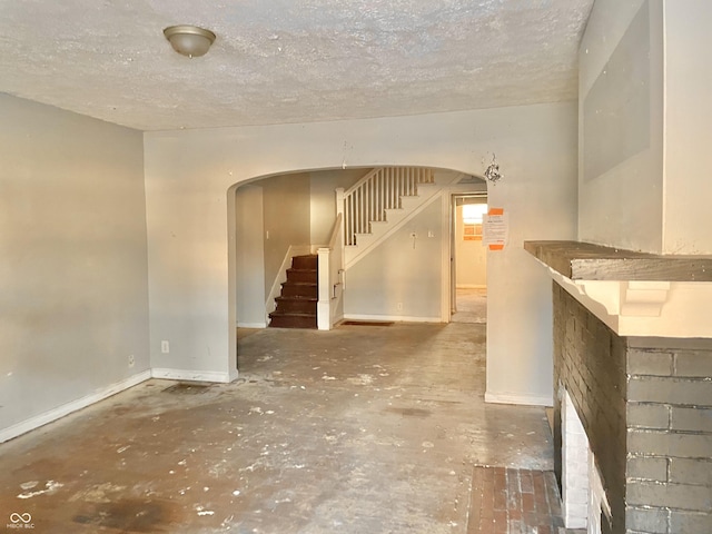 interior space with a textured ceiling