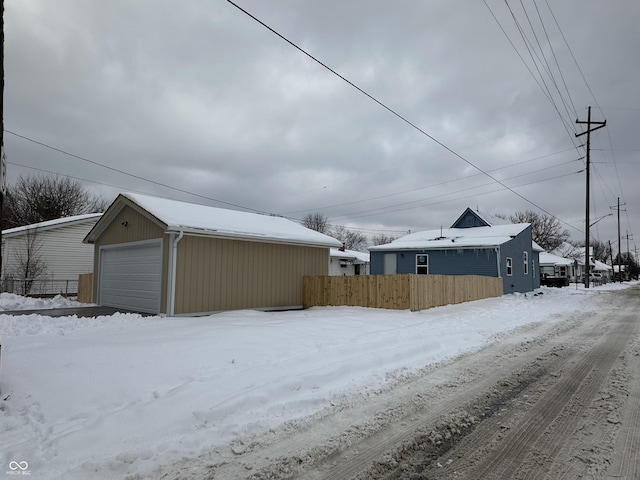 exterior space with an outbuilding and a garage