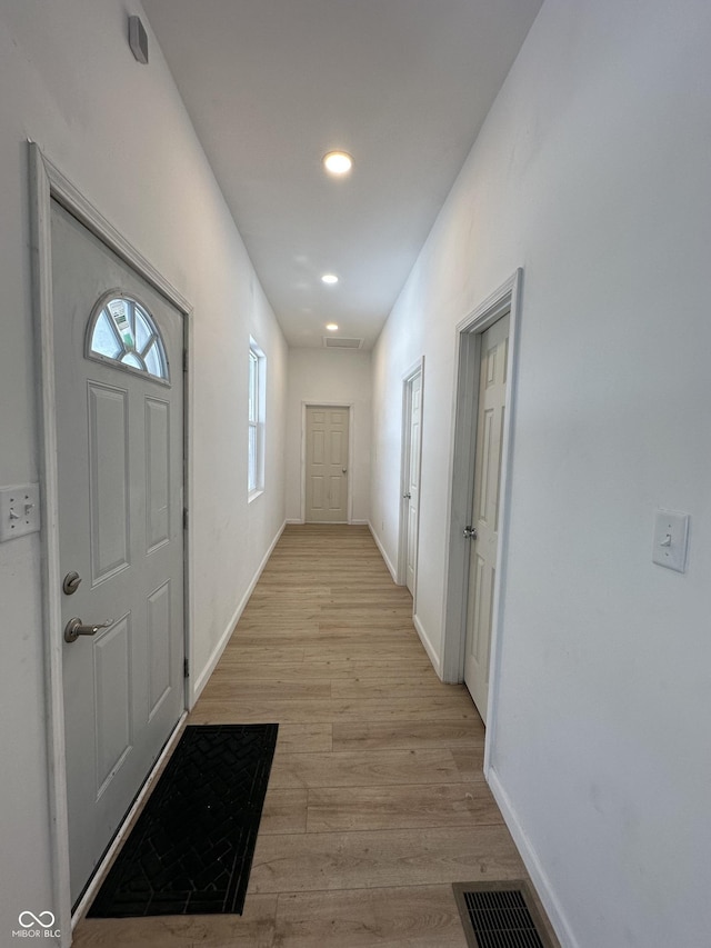 corridor featuring light hardwood / wood-style flooring