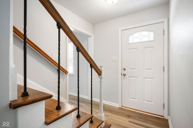 entryway with light hardwood / wood-style floors