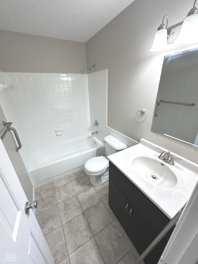 full bathroom featuring vanity, a textured ceiling, shower / bathing tub combination, tile patterned flooring, and toilet