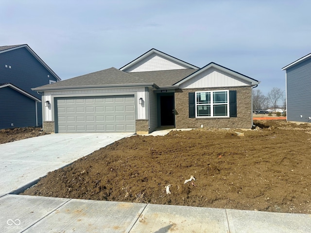 single story home featuring board and batten siding, concrete driveway, a shingled roof, and an attached garage