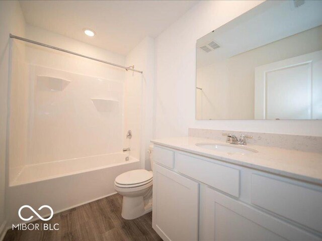 6618 Sulgrove Pl, Indianapolis, IN 46221 - full bath with toilet, vanity, shower / tub combination, wood finished floors, and visible vents