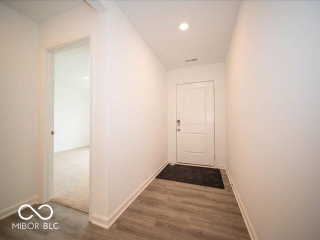 6618 Sulgrove Pl, Indianapolis, IN 46221 - corridor with visible vents, baseboards, and wood finished floors