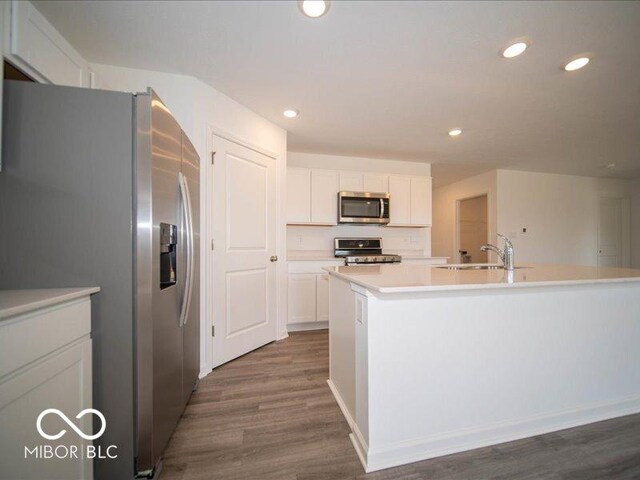 6618 Sulgrove Pl, Indianapolis, IN 46221 - kitchen featuring white cabinets, a sink, stainless steel appliances, and dark wood-style floors