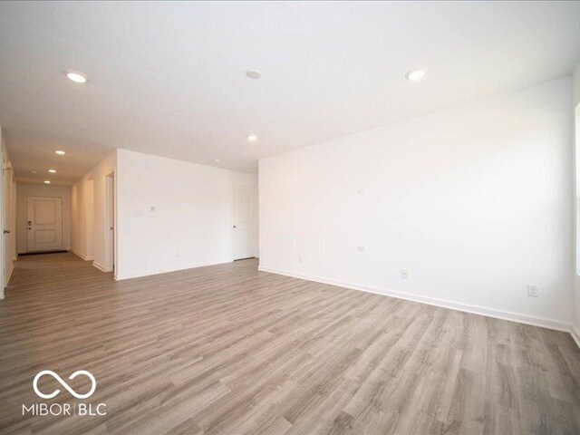 6618 Sulgrove Pl, Indianapolis, IN 46221 - spare room featuring baseboards, light wood-style floors, and recessed lighting