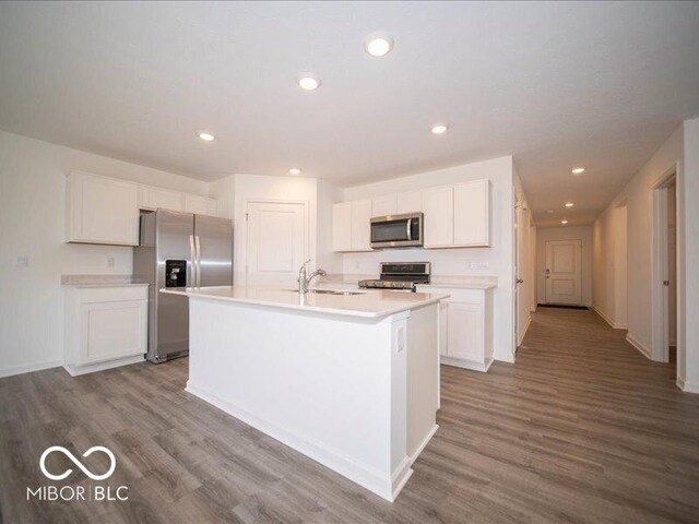 6618 Sulgrove Pl, Indianapolis, IN 46221 - kitchen featuring dark wood finished floors, a sink, white cabinetry, and appliances with stainless steel finishes