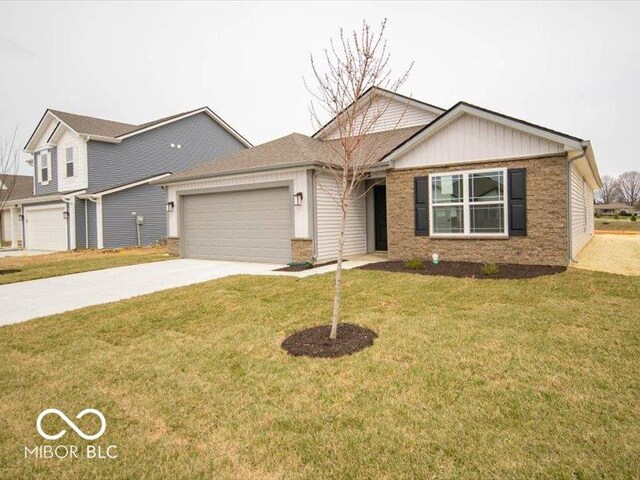 6618 Sulgrove Pl, Indianapolis, IN 46221 - view of front of house with concrete driveway, a front lawn, and an attached garage