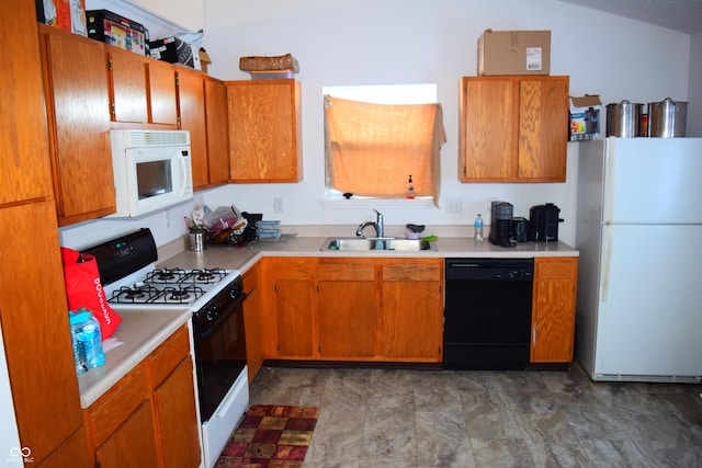 kitchen featuring white appliances and sink