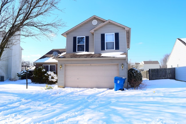 front of property featuring cooling unit and a garage